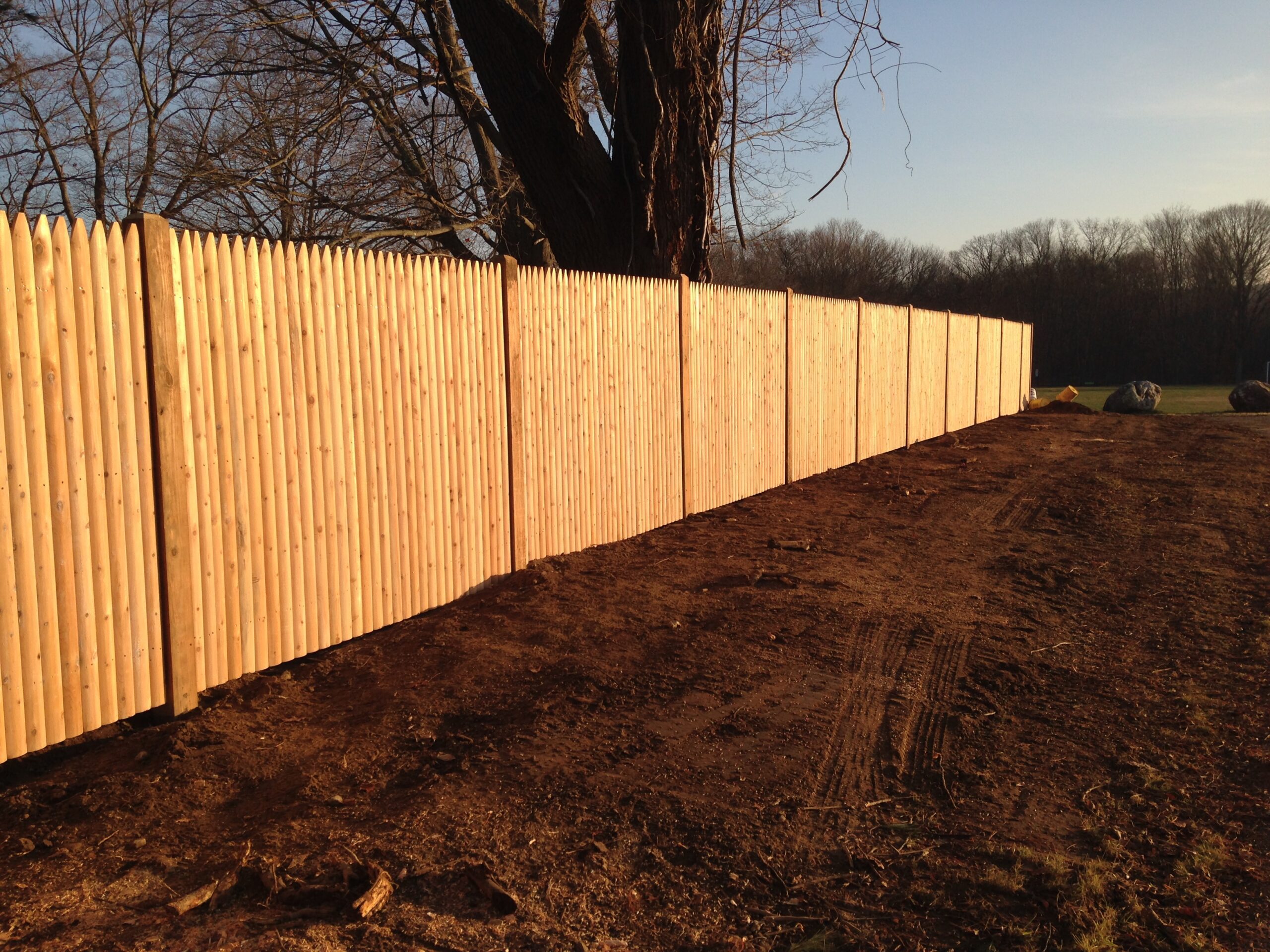 Six-foot cedar stockade privacy fence installed by Arrow Fence in Connecticut