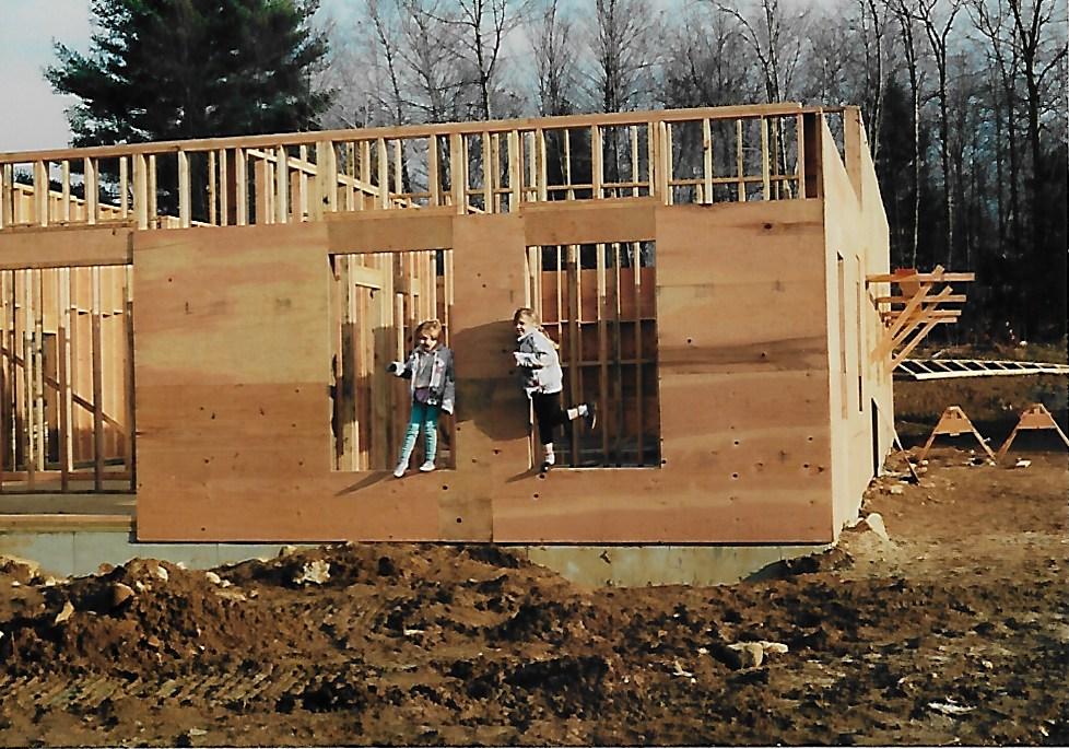 The Howard children standing in the framing of the Arrow Fence headquarters being built on Route 66 in East Hampton Connecticut