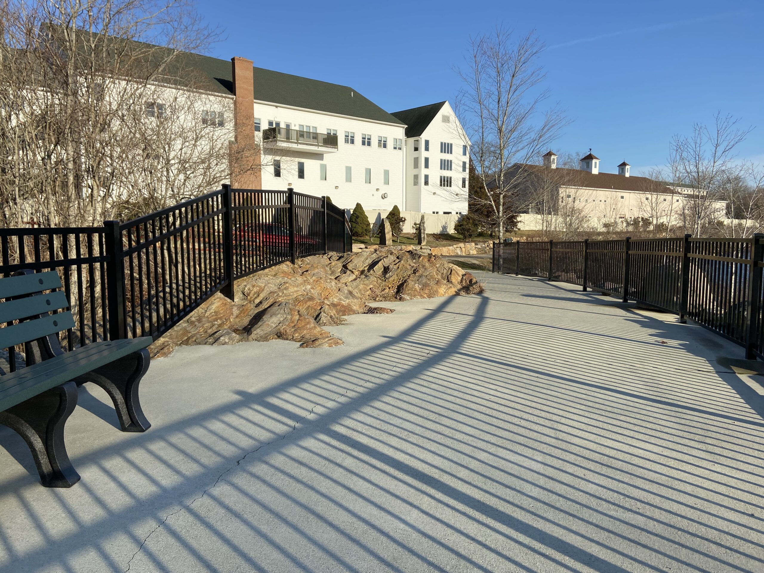 Commercial aluminum fencing lining a public walkway at a Connecticut property