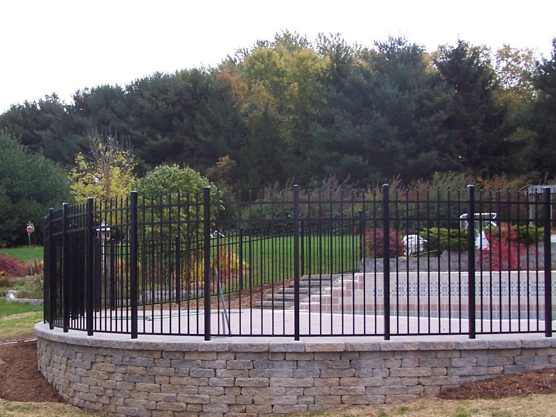 Black aluminum fence panels with durable powder-coated finish in a residential setting