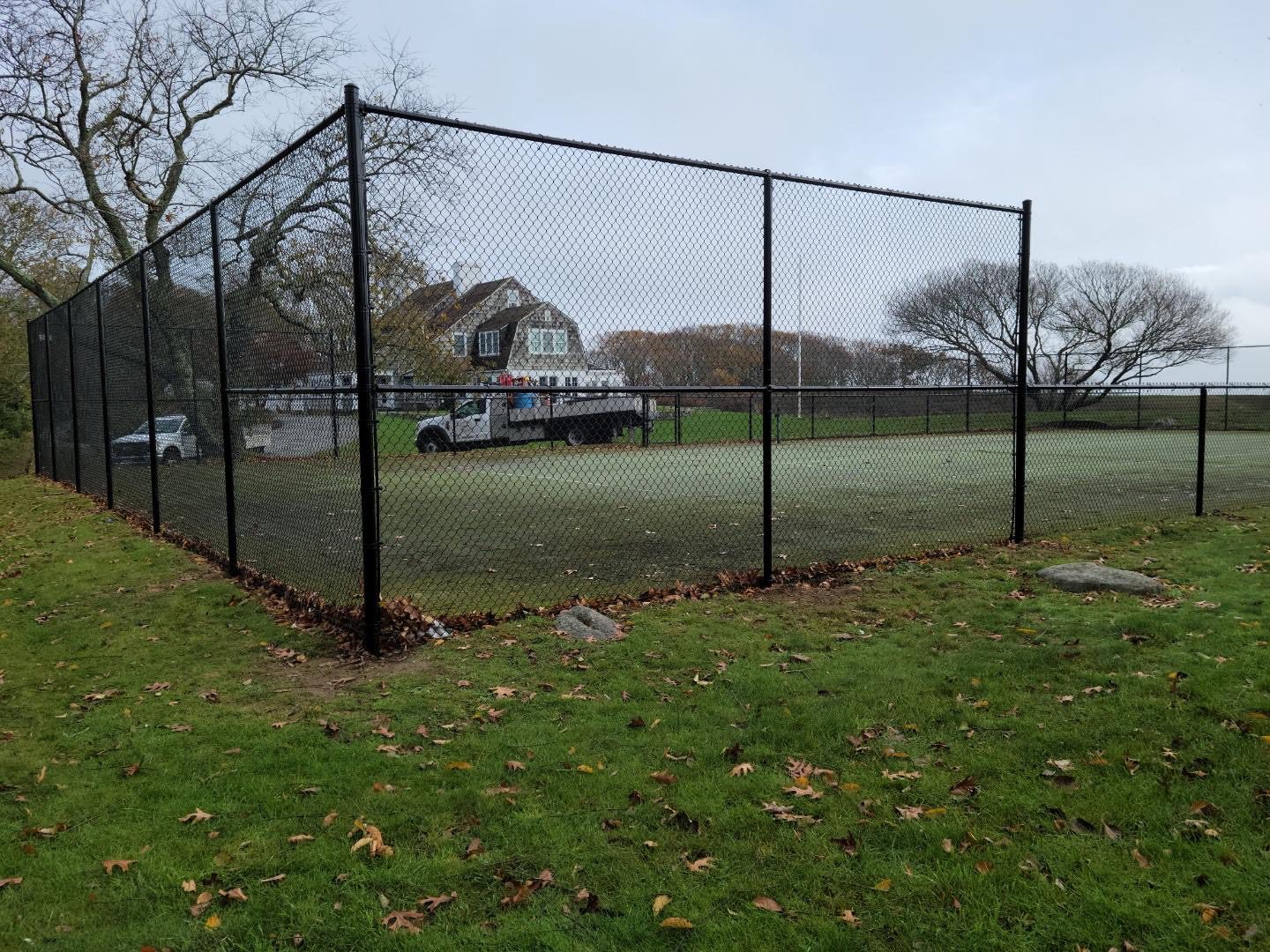 Chain link backstop and perimeter fencing at a Connecticut ball field installed by Arrow Fence