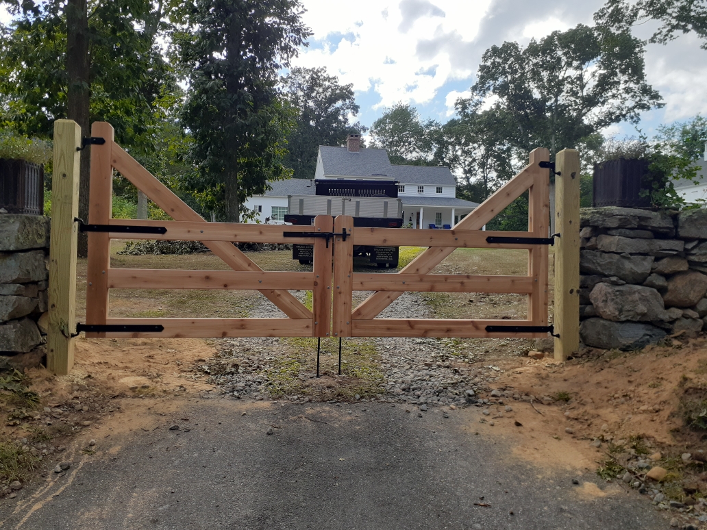 Cedar farm-style post and rail gate installed by Arrow Fence in Connecticut