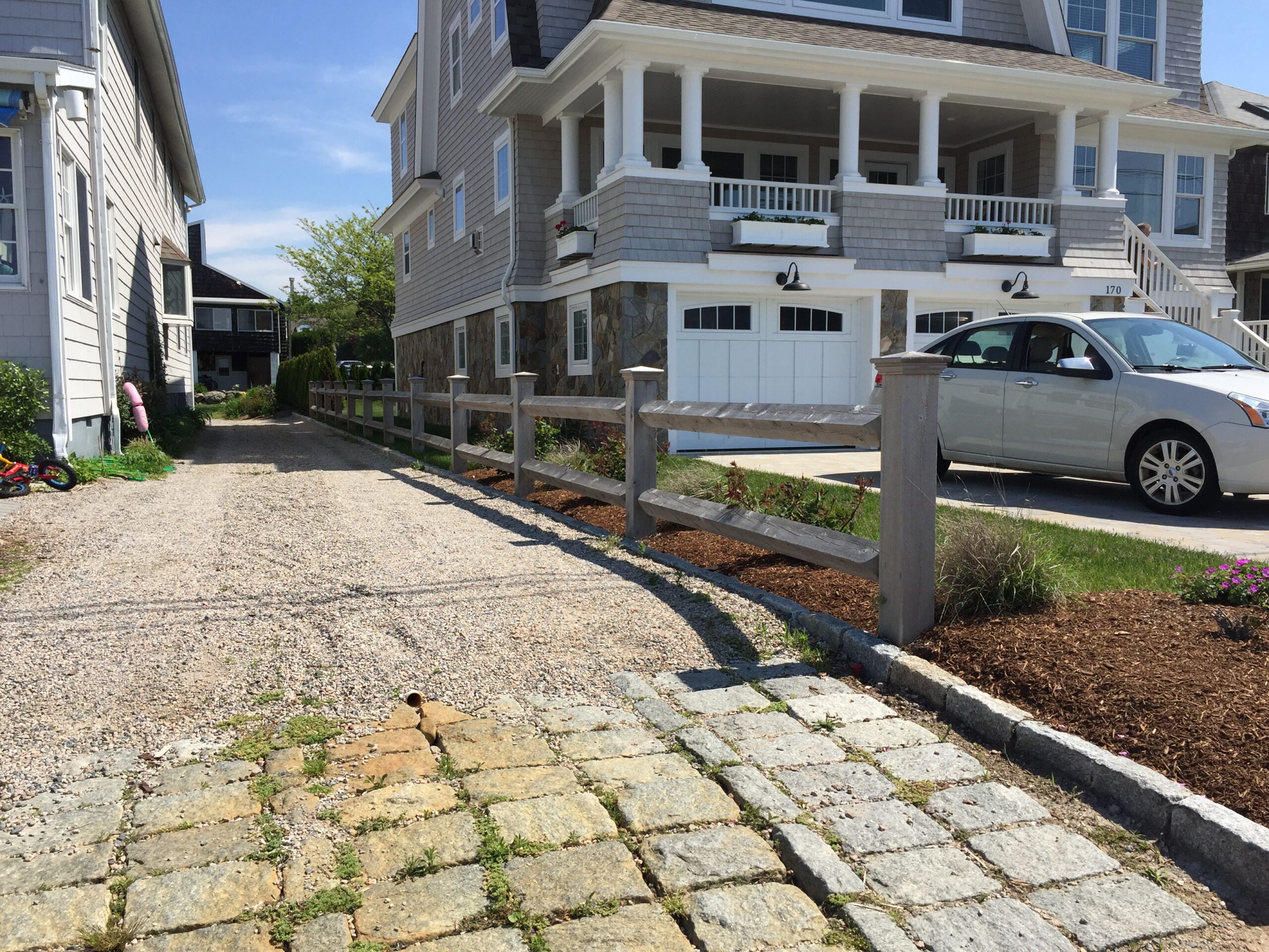 Estate-style square rail fence lining a Connecticut driveway installed by Arrow Fence