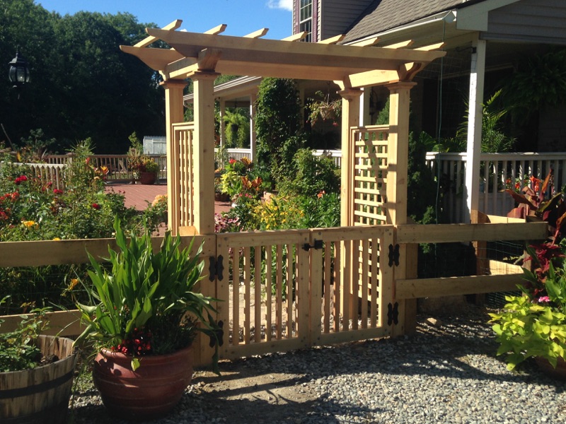 Rail fence with picket gate and arbor entry installed by Arrow Fence in Connecticut